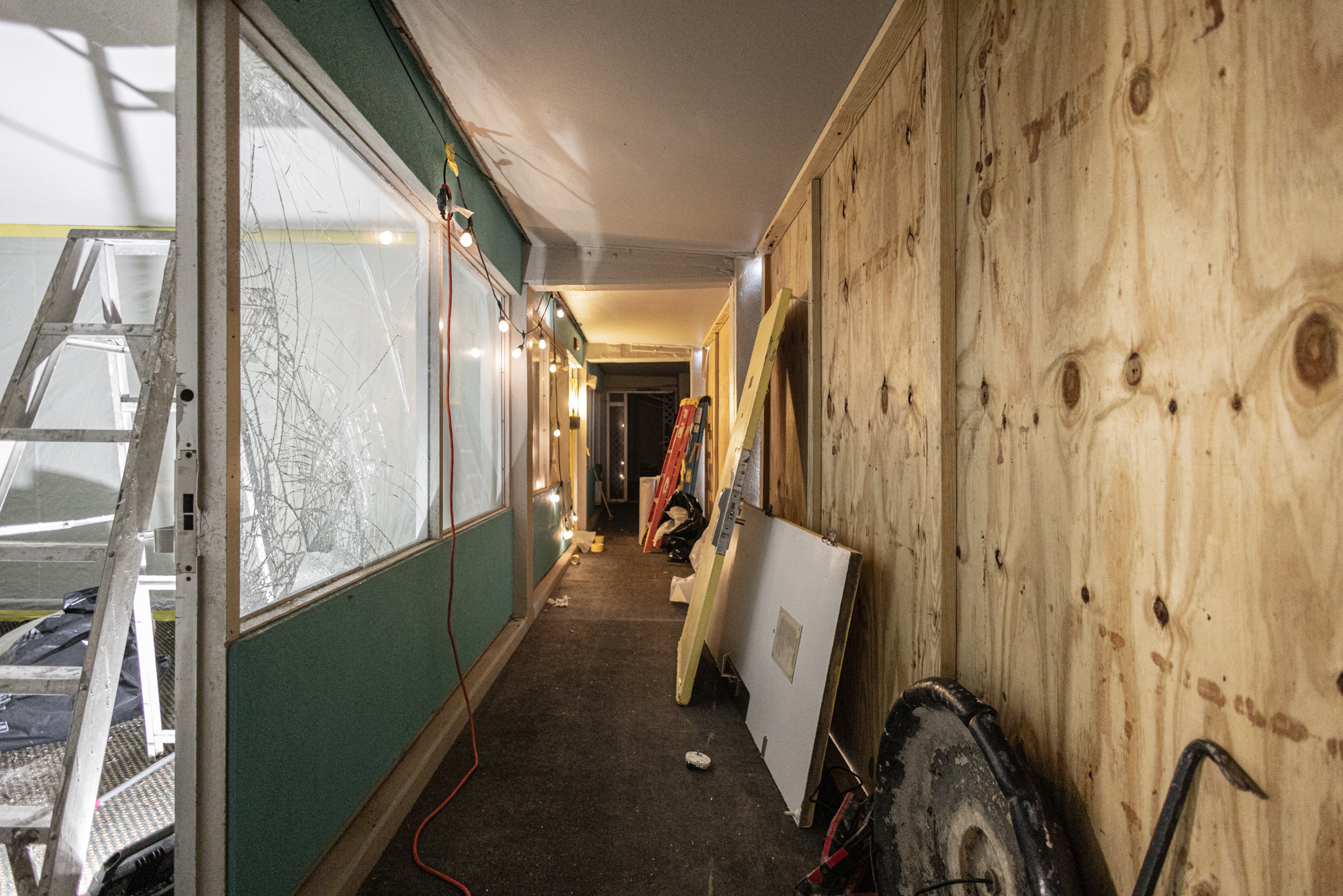 Boarded hallway with plywood paneling during North Tower prep